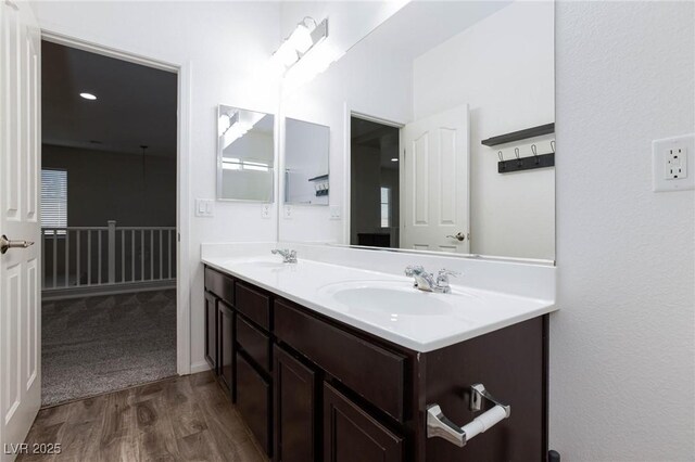 bathroom featuring vanity and hardwood / wood-style flooring