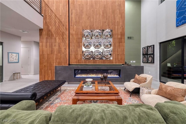 living room featuring a high ceiling