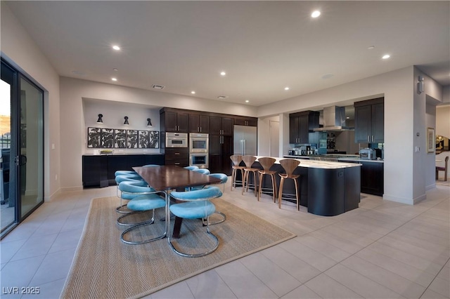 dining area featuring light tile patterned floors