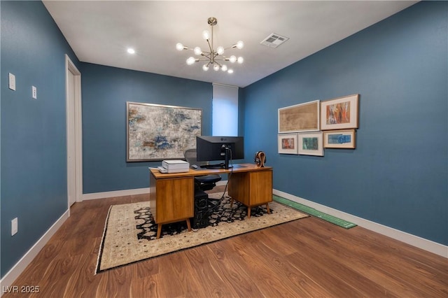 home office with a chandelier and wood-type flooring