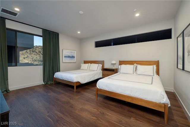 bedroom featuring dark hardwood / wood-style floors