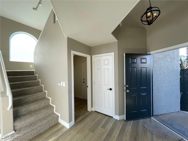 entrance foyer with a chandelier and hardwood / wood-style floors