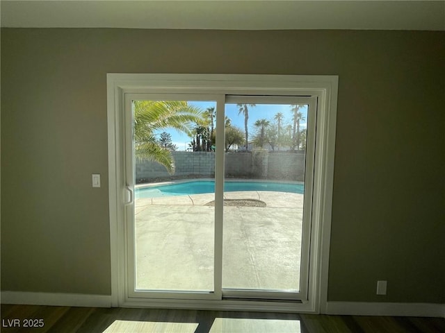 doorway to outside featuring hardwood / wood-style floors and a wealth of natural light