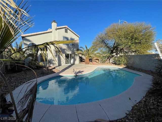 view of swimming pool with a patio