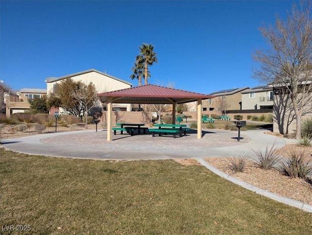 view of community featuring a lawn and a gazebo