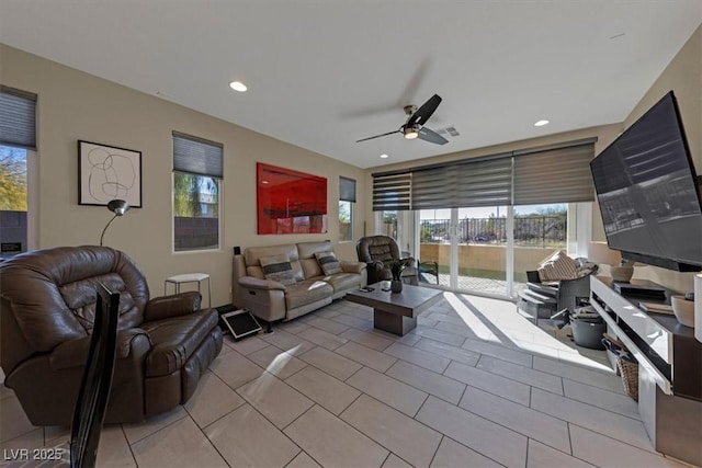 living room with plenty of natural light, ceiling fan, and recessed lighting