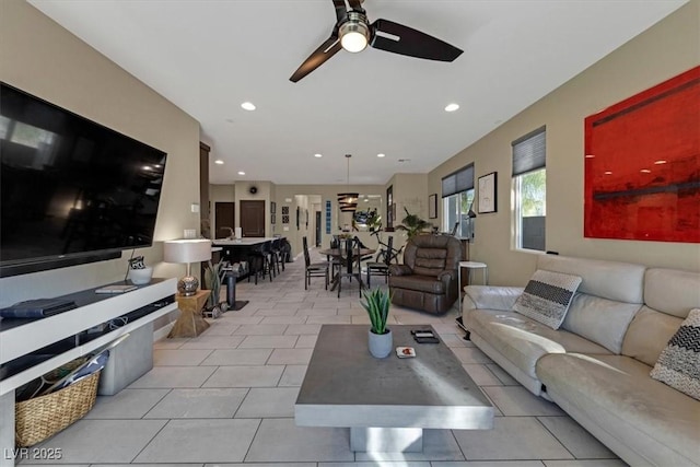 living area featuring a ceiling fan, recessed lighting, and light tile patterned flooring