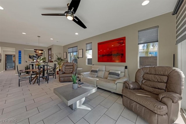 living room featuring ceiling fan and recessed lighting