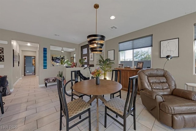 dining room with visible vents and baseboards