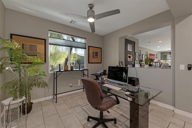 office with ceiling fan, light tile patterned flooring, visible vents, and baseboards