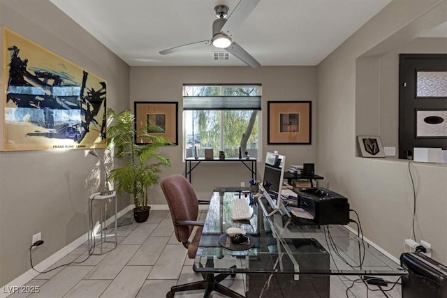 office with a ceiling fan, visible vents, baseboards, and light tile patterned floors