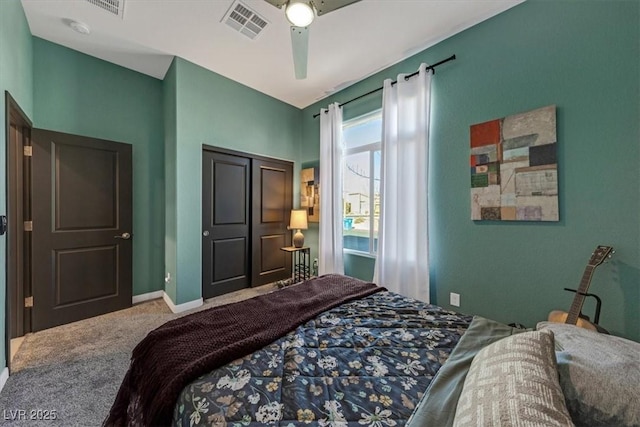 carpeted bedroom with baseboards, visible vents, ceiling fan, and a closet