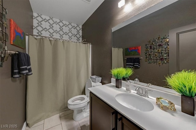 full bathroom featuring tile patterned flooring, vanity, and toilet