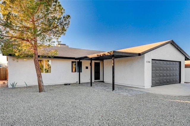 ranch-style home featuring a garage