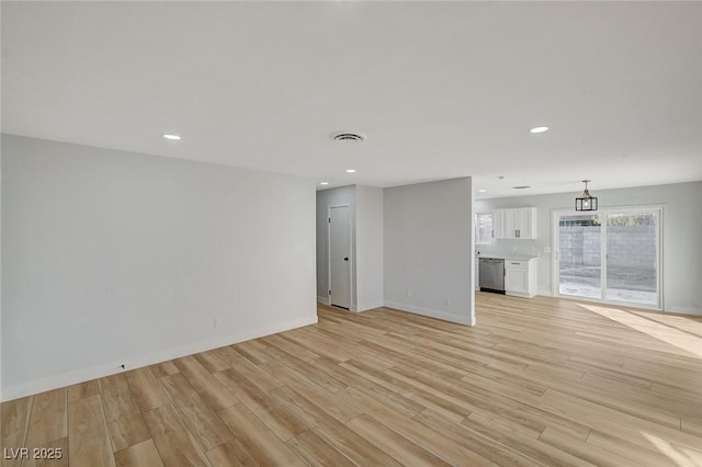 unfurnished living room with light wood-type flooring