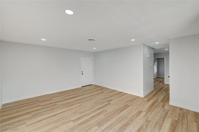 unfurnished room with light hardwood / wood-style floors