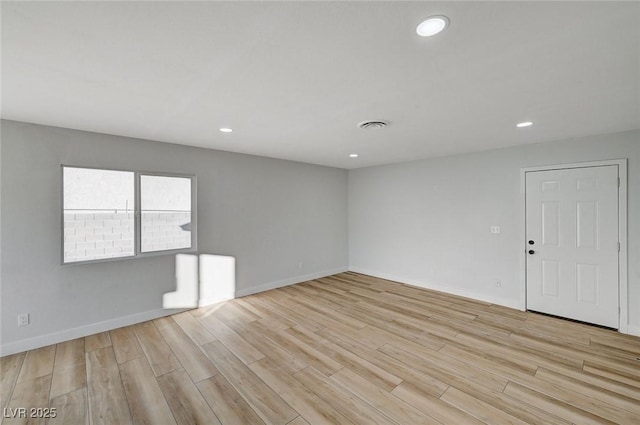 spare room with light wood-type flooring