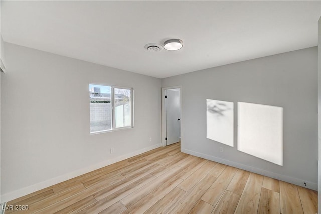 empty room with light wood-type flooring