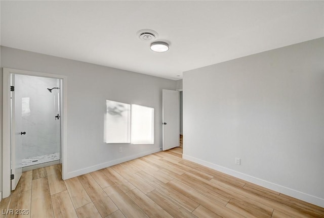 spare room featuring light hardwood / wood-style floors