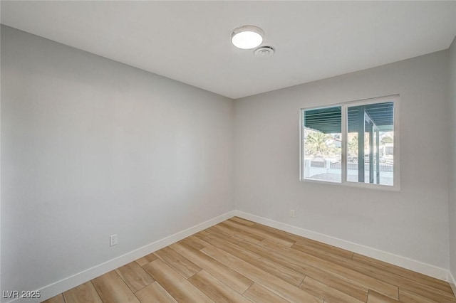 spare room featuring hardwood / wood-style flooring