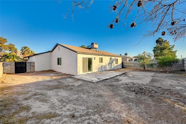 back of property featuring a patio