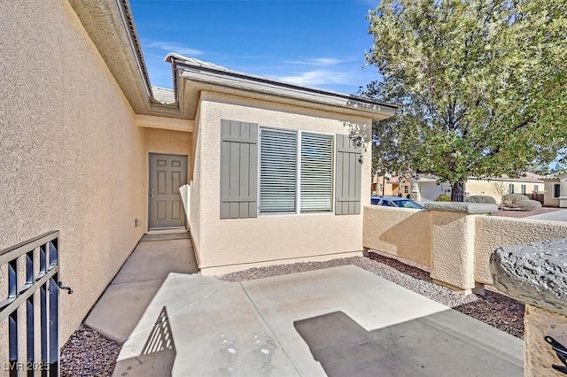 doorway to property featuring a patio