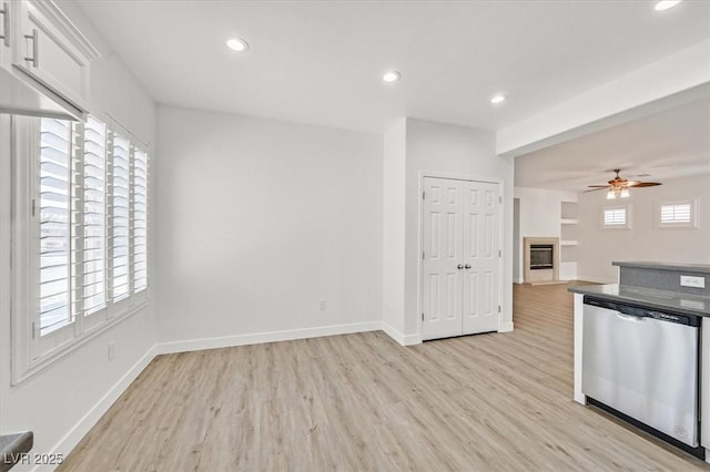 kitchen featuring dishwasher, light hardwood / wood-style flooring, white cabinetry, built in features, and ceiling fan