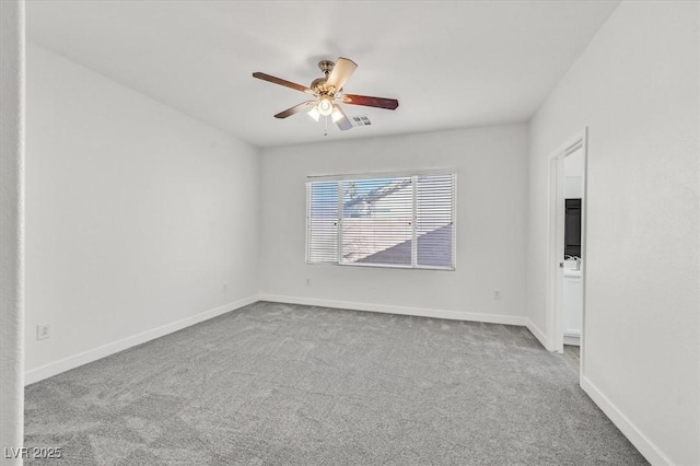 carpeted empty room with ceiling fan