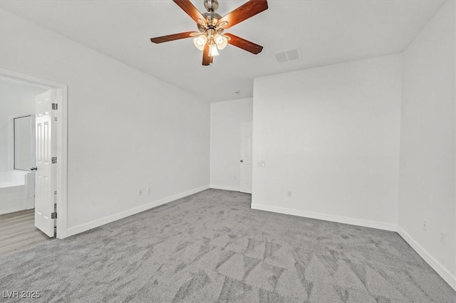 empty room with light carpet and ceiling fan