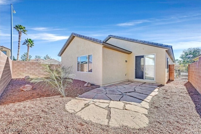 rear view of property with a patio area