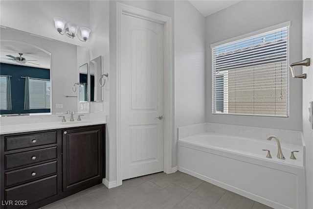 bathroom with a bath, ceiling fan, tile patterned flooring, and vanity