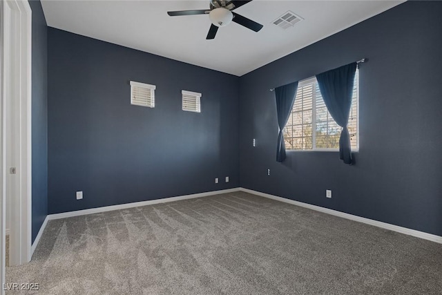 spare room with carpet and ceiling fan