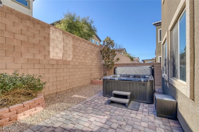 view of patio / terrace featuring a hot tub