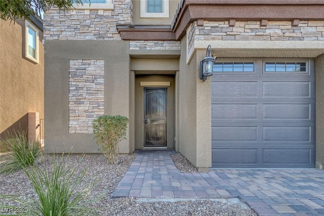 entrance to property featuring a garage