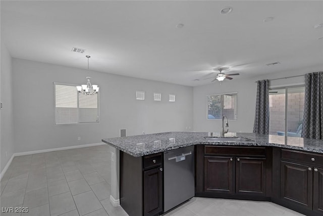 kitchen with dishwasher, light stone countertops, ceiling fan with notable chandelier, dark brown cabinetry, and sink