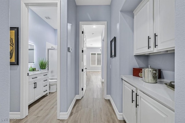 hallway featuring light wood-type flooring