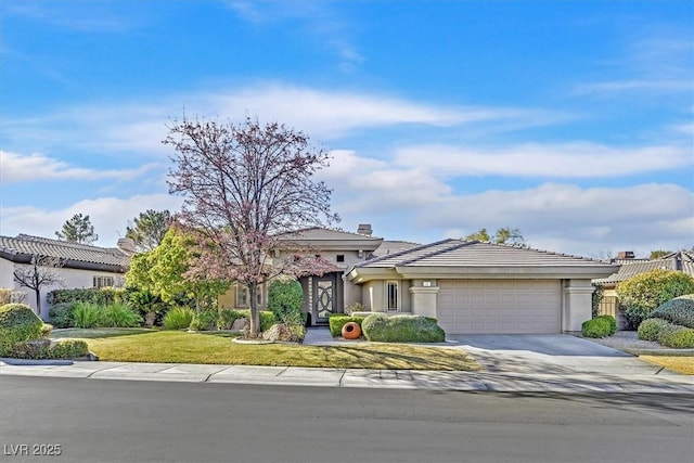 view of front facade featuring a front lawn and a garage