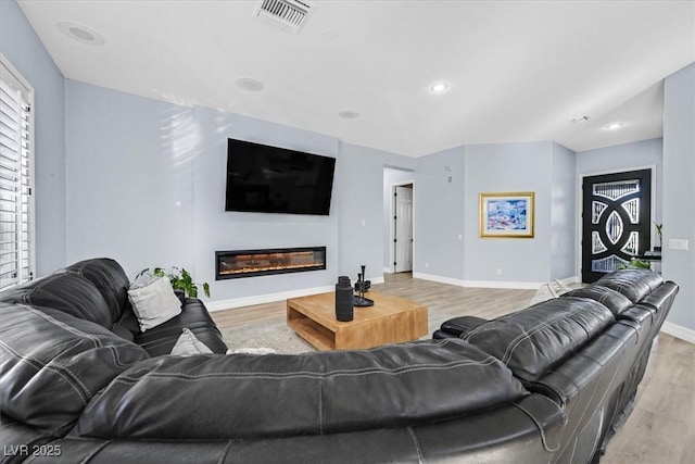 living room with light hardwood / wood-style floors