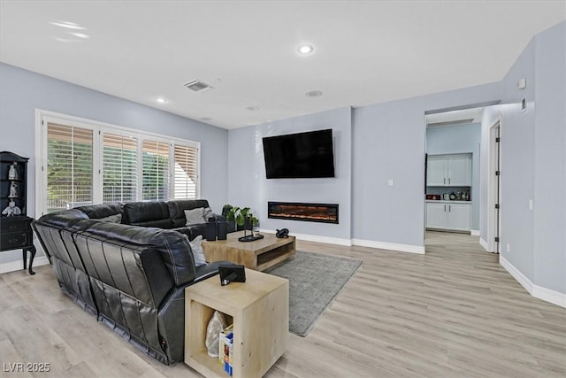 living room with light wood-type flooring