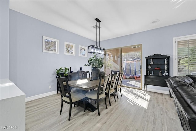 dining room featuring light hardwood / wood-style floors