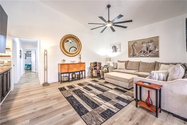 living room with ceiling fan and light hardwood / wood-style floors