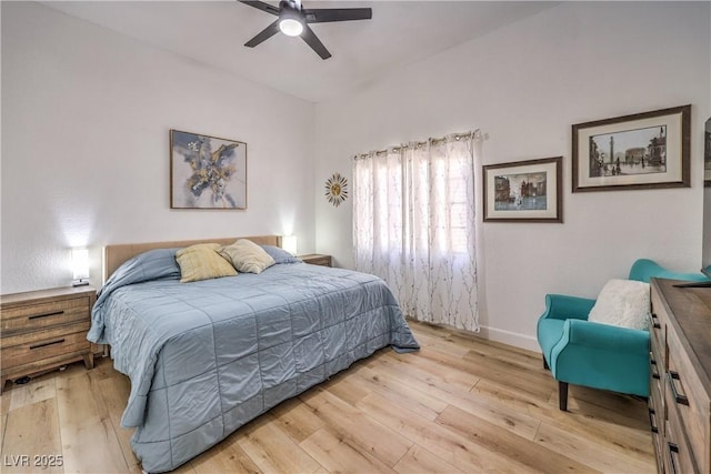 bedroom with ceiling fan and light hardwood / wood-style flooring