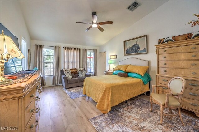 bedroom featuring lofted ceiling, ceiling fan, and light hardwood / wood-style floors