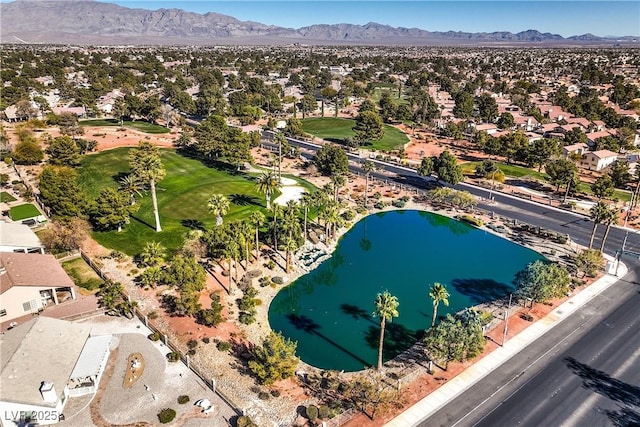 drone / aerial view featuring a water and mountain view