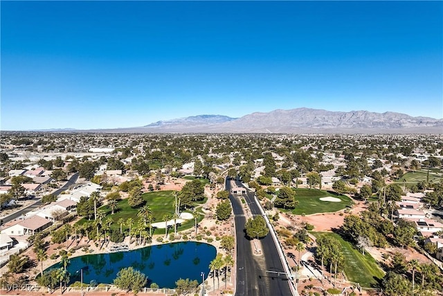 drone / aerial view featuring a water and mountain view