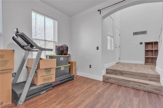 workout room with wood-type flooring