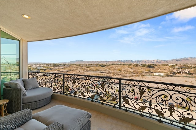 balcony with a mountain view and outdoor lounge area