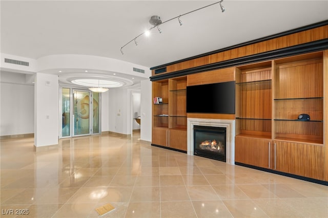 unfurnished living room featuring light tile patterned flooring