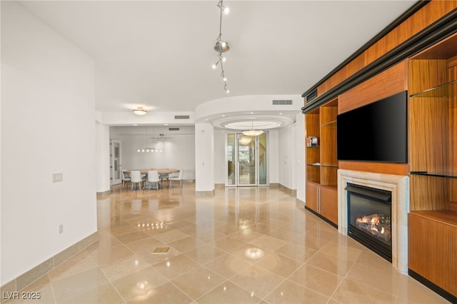 unfurnished living room with light tile patterned flooring