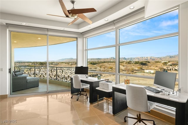 tiled home office with ceiling fan and floor to ceiling windows